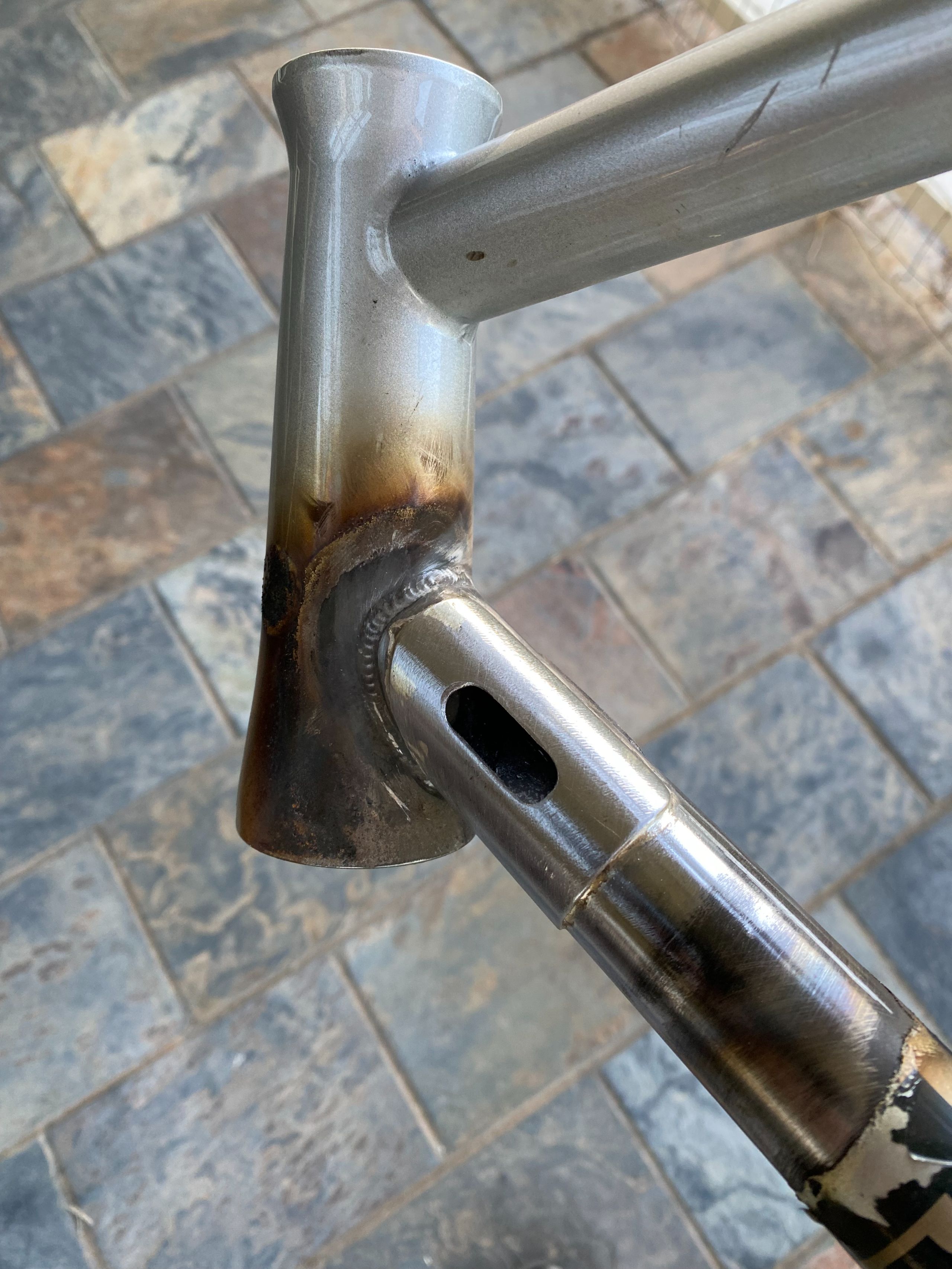Repair cracked down tube with a patch